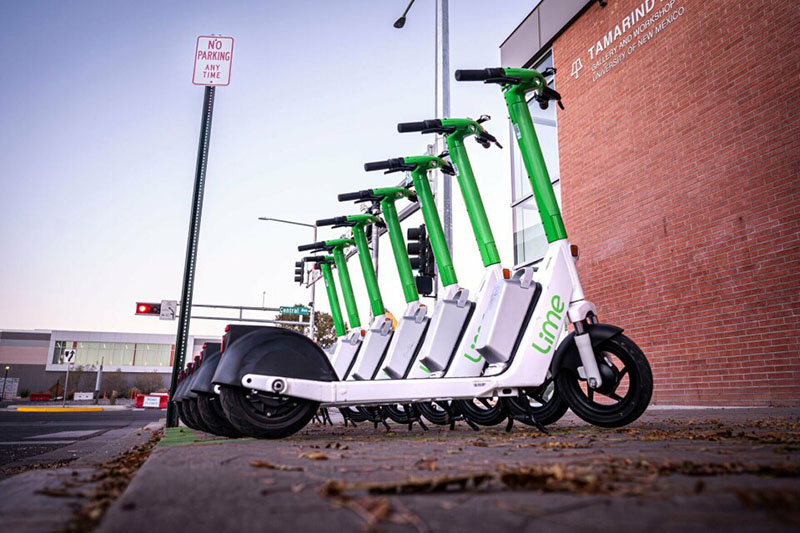 escooters parking on sidewalk near campus