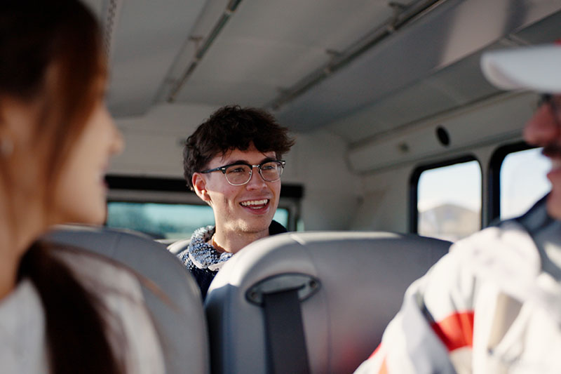students aboard pats shuttle traveling to campus